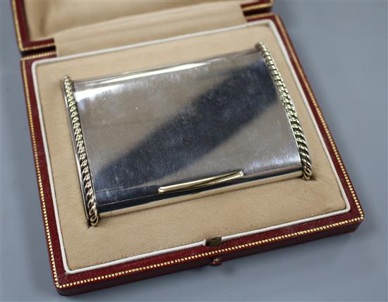 A George VI Cartier silver and yellow metal mounted cigarette case, in original fitted Cartier gilt tooled leather box.